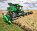 Combine harvesting wheat during the U.S. Custom Harvesters annual harvest season.