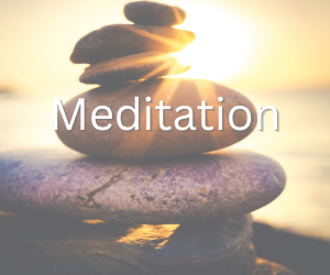 Stacked balancing stones at sunrise with sunlight shining through, symbolizing peace, reflection, and meditation.