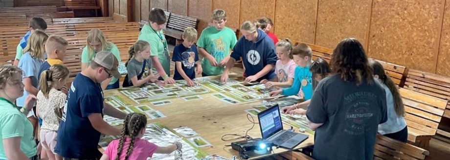 A Missouri 4-H teen leader presents this year’s Ag Innovators Experience activity to a group at a 4-H camp in central Missouri.