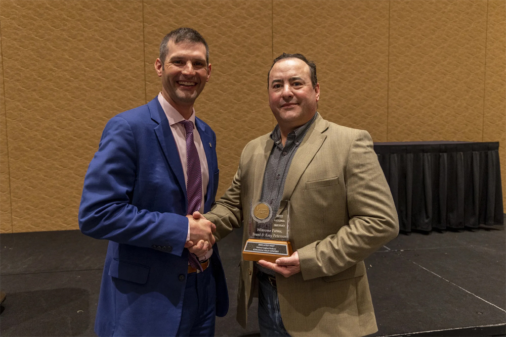 Brant Peterson accepts his award during the 2022 NSP Yield Contest banquet in Orlando, Fl. (Photo credit: National Sorghum Producers)