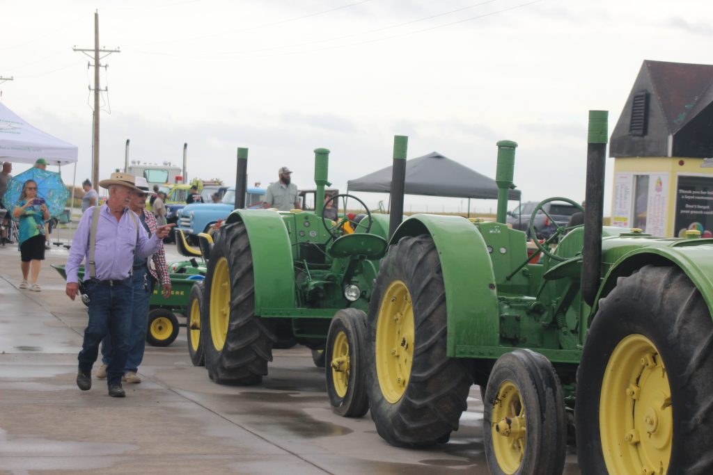 A line of tractors was a popular attraction at Keating Tractor’s antique machinery show that coincided with the farm equipment dealer’s 65th anniversary in Liberal, Kansas. (Journal photo by Dave Bergmeier.)