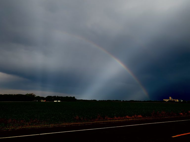 The ADM terminal, Salina, Kansas, looks like it’s painted in gold, or at least amber, as a rainbow arches over the horizon following a recent thunderstorm. (Journal photo by Tim Unruh.)