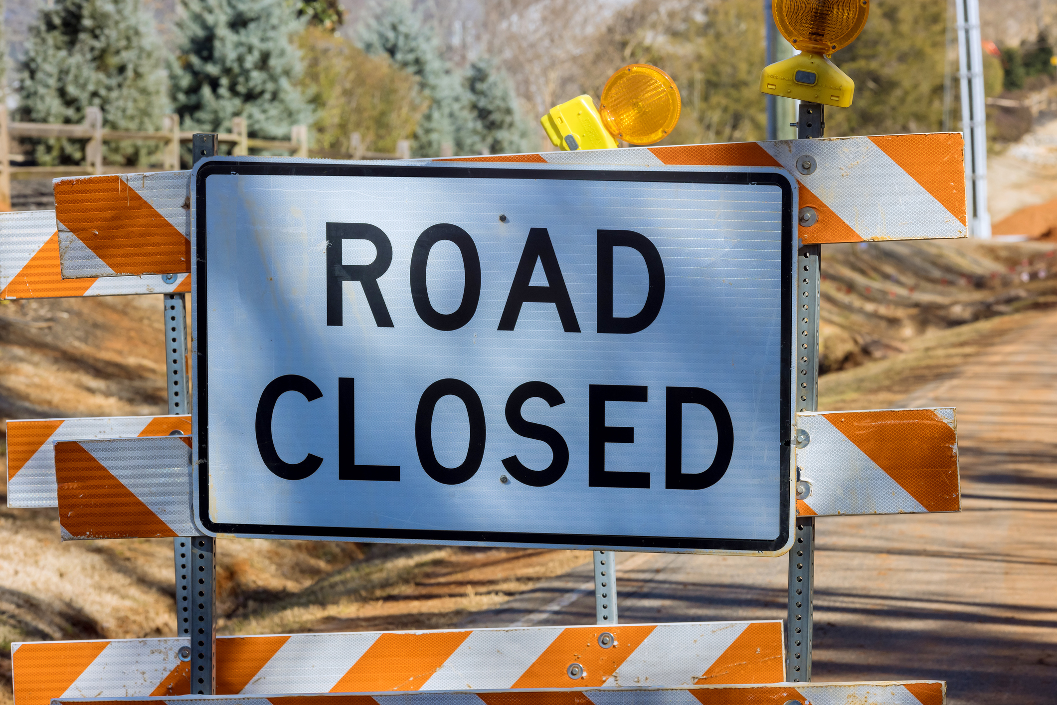 Road closed caution sign on highway in road reconstruction (iStock photo by photovs)