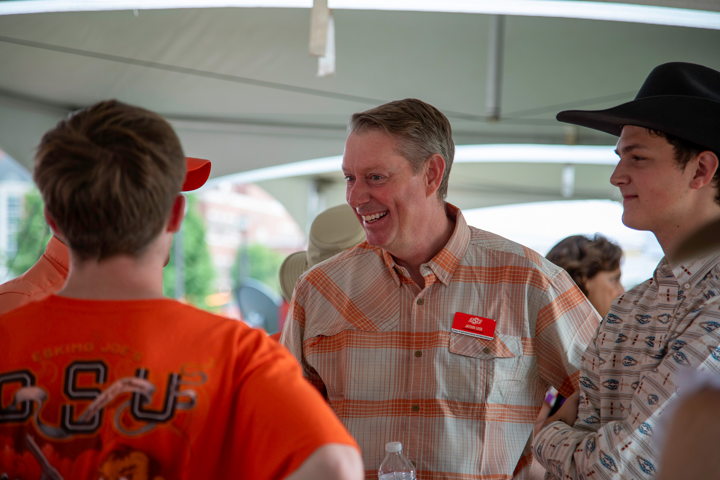 Jayson Lusk, vice president and dean of Oklahoma State University Agriculture, meets and greets New Frontiers donors and Ferguson College of Agriculture friends and alumni during the New Frontiers Tailgate. (Photo by Bryanna Birdsong, OSU Foundation.)