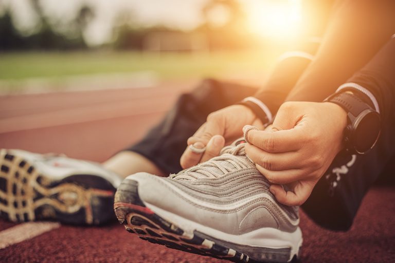 Man prepares to run for exercise. (Adobe Stock │ #294433929 - Urupong)