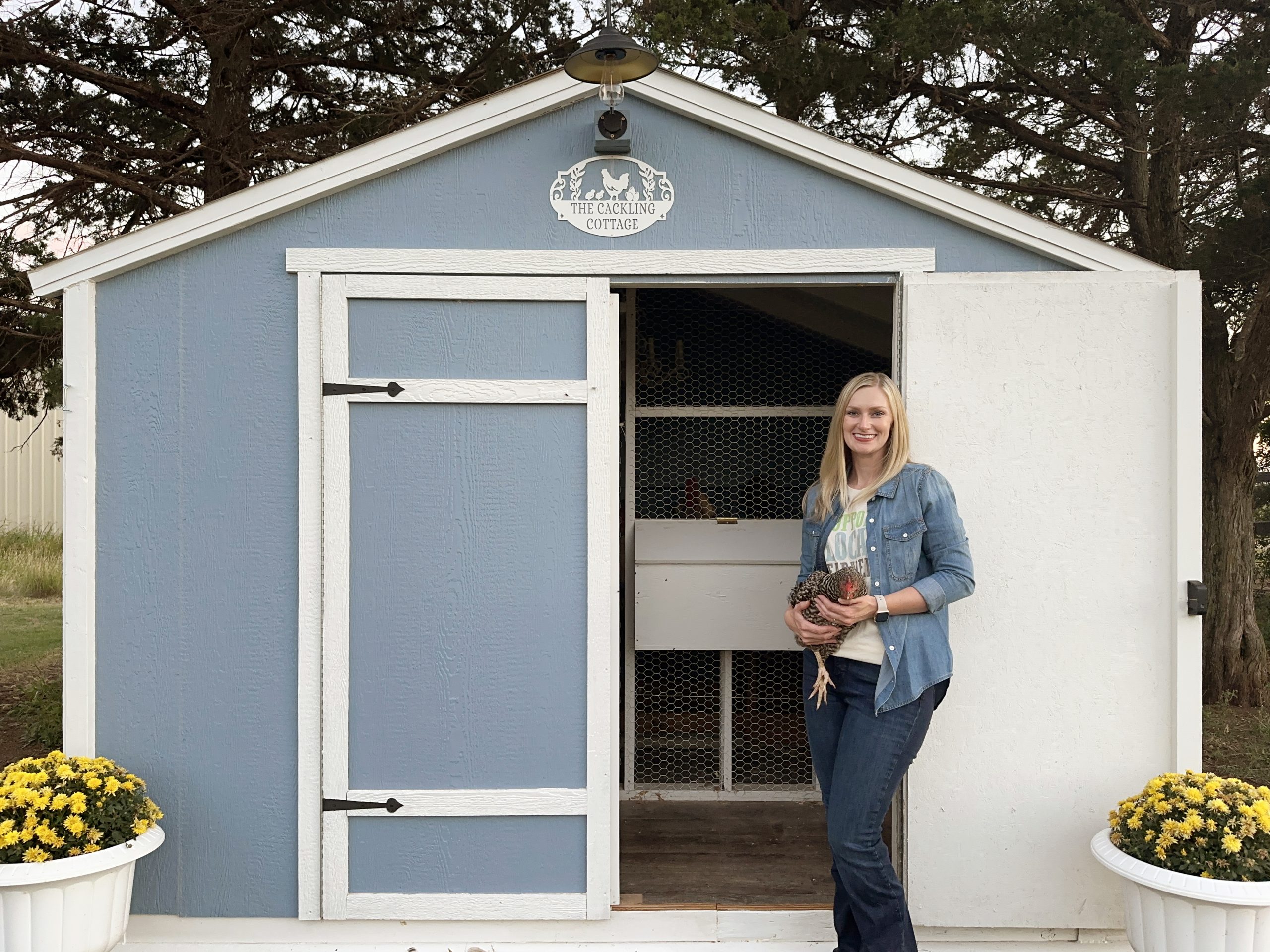 Lacey Vilhauer with her newly finished chicken coop.