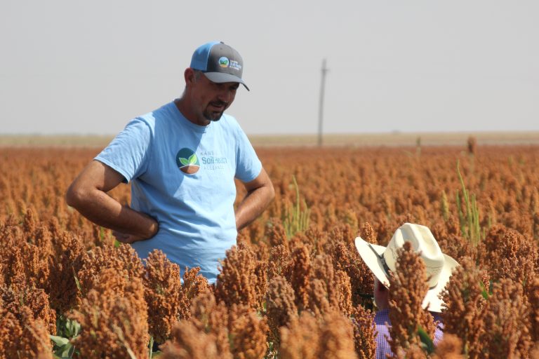 Michael Thompson, Almena, Kansas, listens to a young questioner during a Farmer 2 Farmer tour in Larned, Kansas. (Journal photo by Dave Bergmeier.)