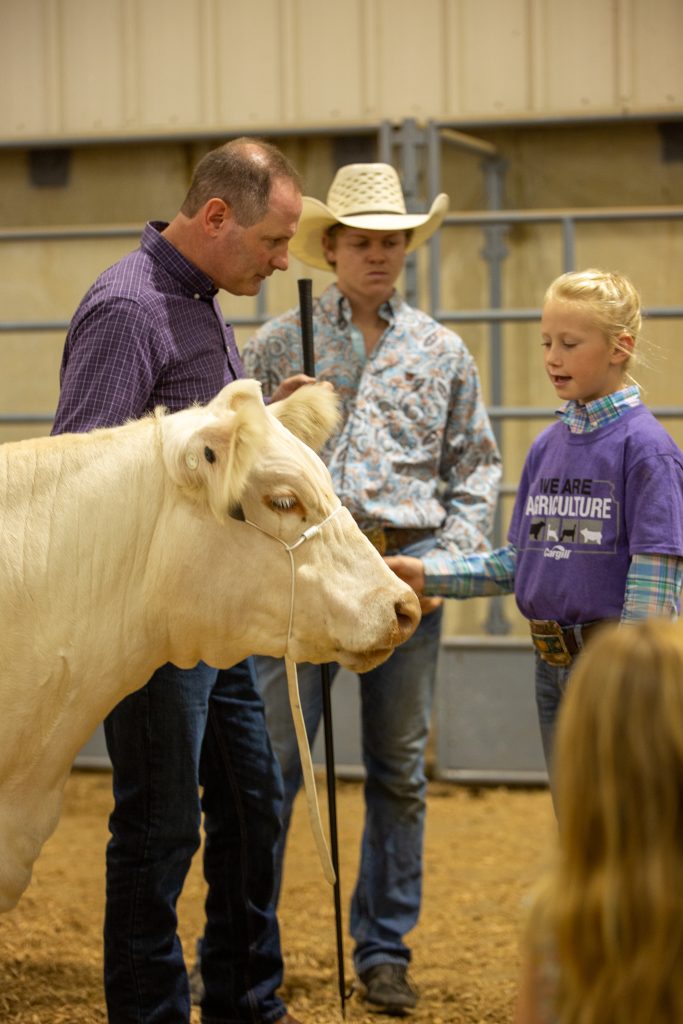 Junior livestock exhibitors were paired with Kansas legislators to mentor them in the Legislative Showmanship contest on Sept. 9 at the Kansas State Fair. U.S. Representative, Tracy Mann, was crowned champion showman. Coached by Josie Heter. (Journal photo by Kylene Scott.)