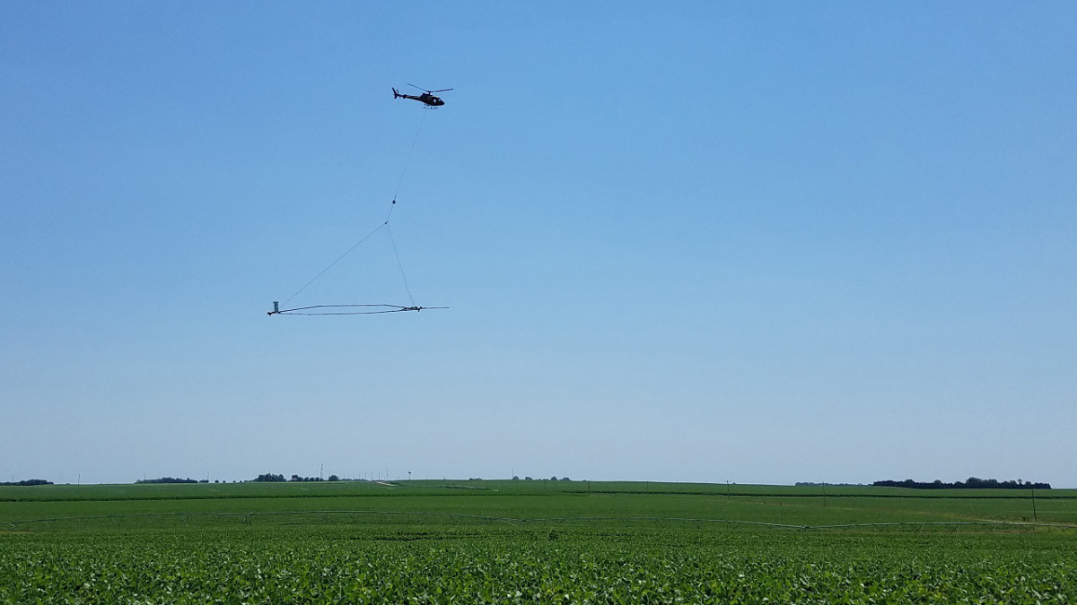Nebraska has pioneered the use of airborne electromagnetics on a regional scale for aquifer mapping, thereby boosting groundwater management capability. A helicopter carries a large loop of wire whose electromagnetic signaling help image subsurface conditions and create a 3D geological model. (Photo: Katie Cameron | Natural Resources)