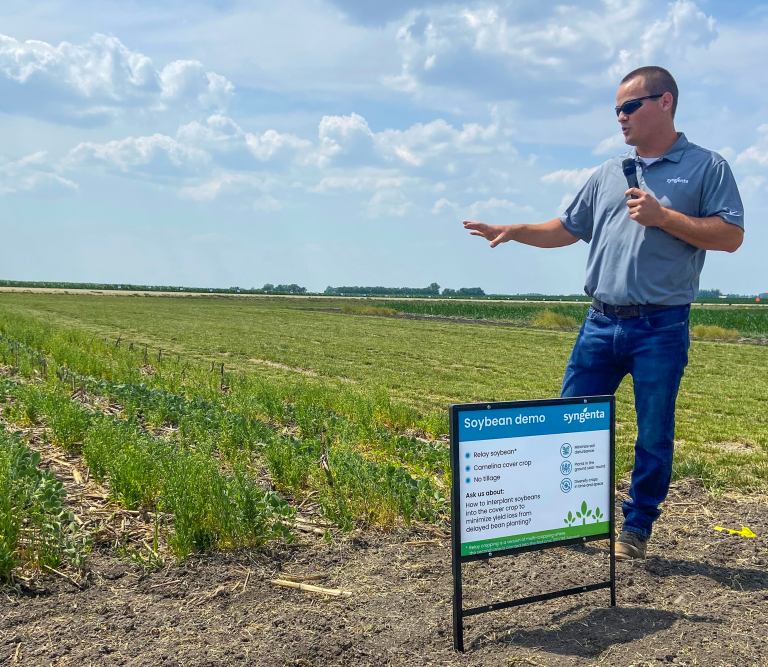 Syngenta Agronomic Research Scientist Brad Bernhard briefs visitors at one of the Syngenta regenerative agriculture field demos on the importance of ‘relay cropping’ with camelina so farmers can reap the benefits of this practice without delaying their regular planting timelines. (Photo courtesy of Syngenta Seeds LLC.)