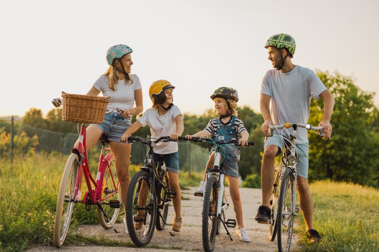 Happy family cycling together in the countryside (Photo: iStock - PIKSEL)