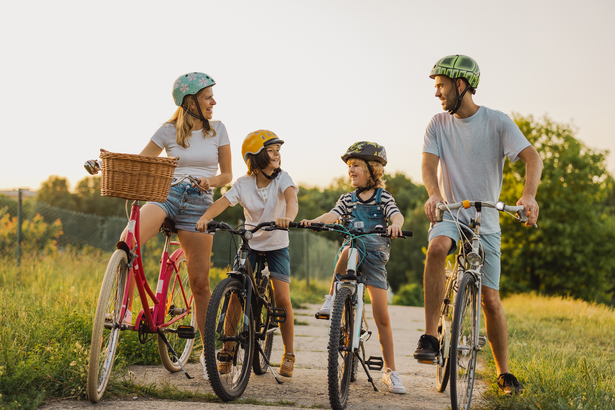 Happy family cycling together in the countryside (Photo: iStock - PIKSEL)