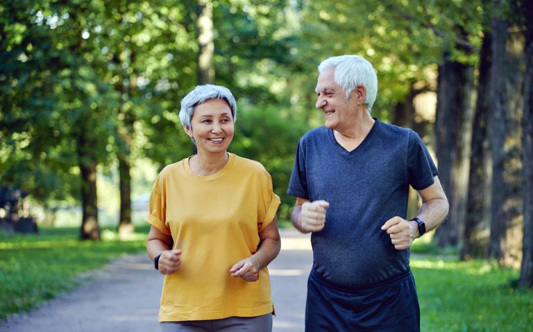 Senior couple jogging in the summer park (Photo: iStock - amoklv)