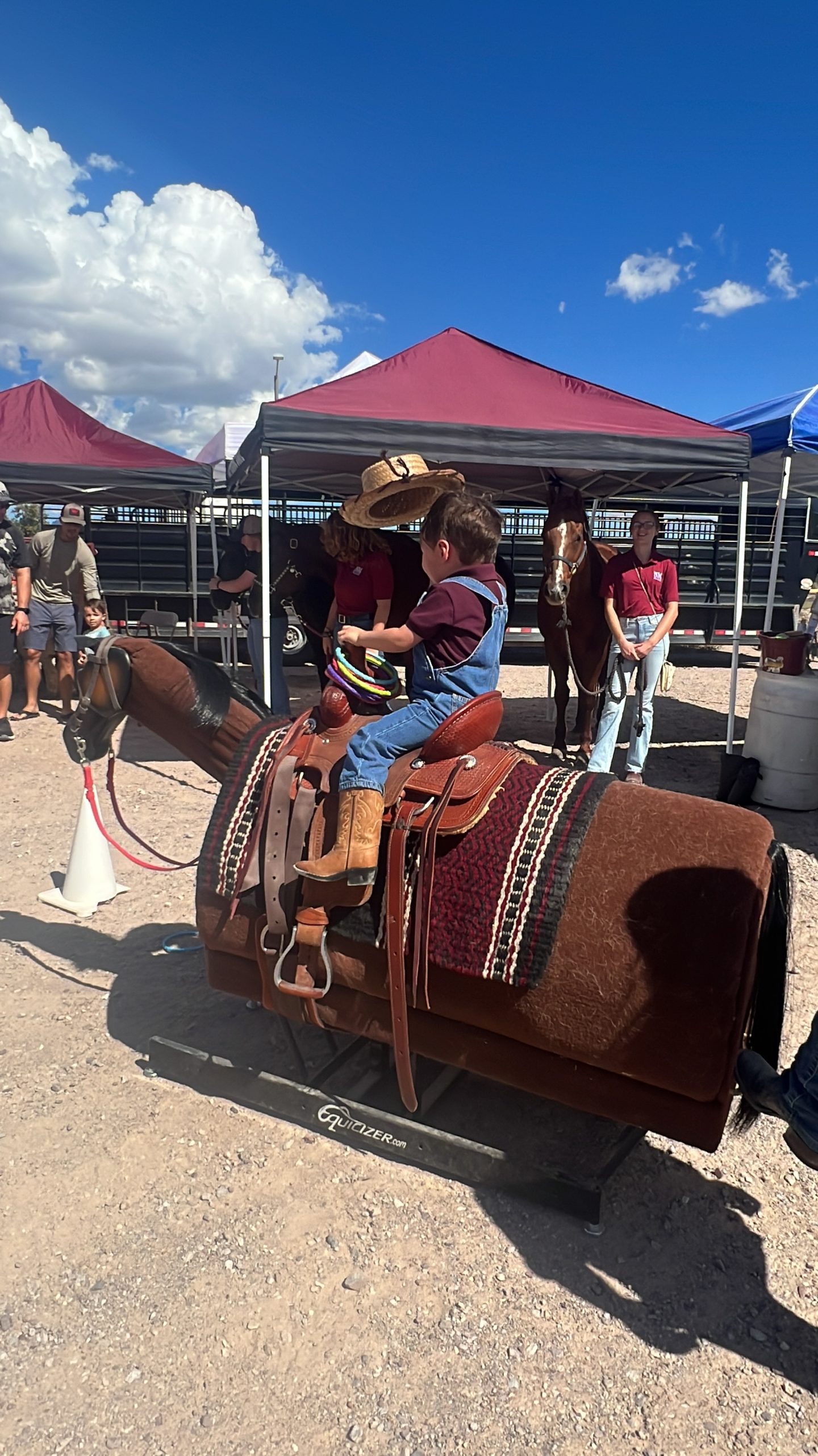 A young cowboy enjoys the fun at AG Day by riding a rocking horse. The 2023 AG Day is Nov. 4 at New Mexico State University. AG Day is a free, educational event that features family-friendly activities from 1 to 4 p.m. leading up to the Aggie football game at 4 p.m. (Photo courtesy New Mexico Department of Agriculture.)