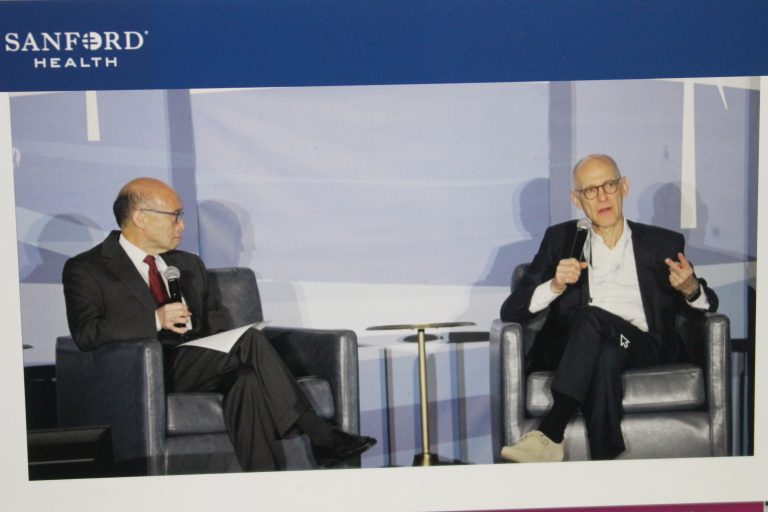 Dr. Ezekiel Emanuel, at right, discusses challenges rural residents face as moderator Dr. Thomas Lee listens. Dr. Emanuel was a presenter at Sanford Health’s Summit on the Future of Rural Health Care. (Journal photo by Dave Bergmeier.)