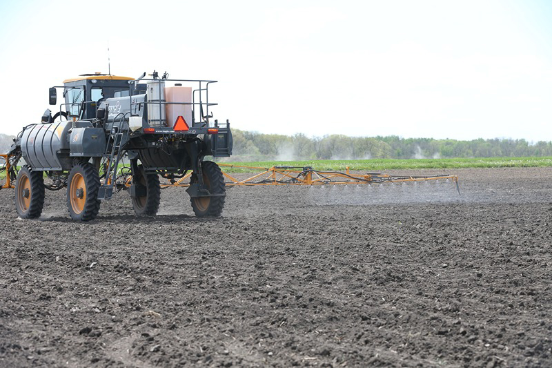 A chemical applicator drives through a field to spray nitrogen onto a field. (Photo by Tom Campbell, Purdue Agricultural Communications.)