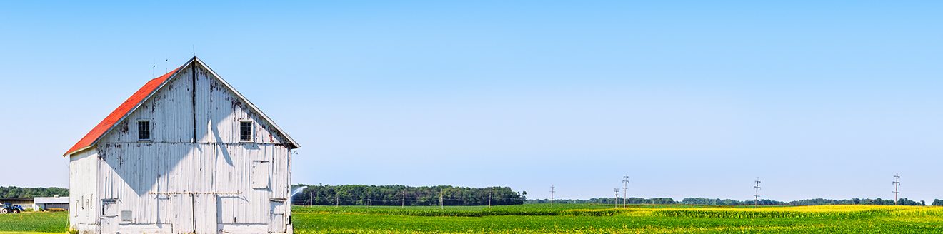 Panoramic farmland with white barn. (Courtesy photo.)