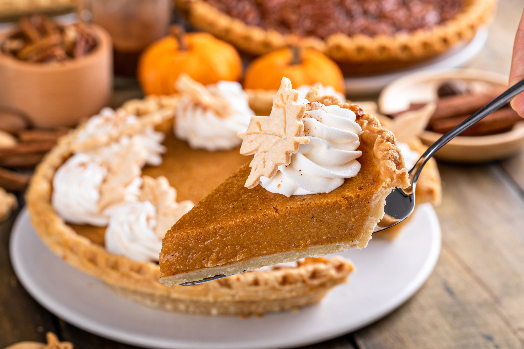 Slice of pumpkin pie with whipped cream on top, traditional fall dessert for Thanksgiving (Photo: iStock - VeselovaElena)