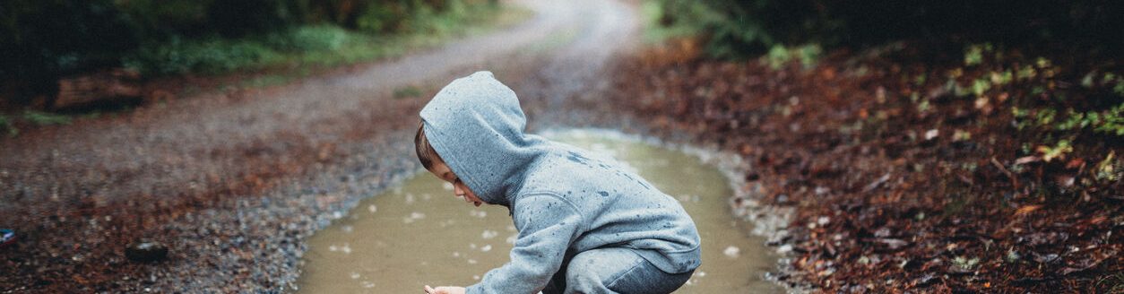 Child playing in puddle (Photo: iStock - RyanJLane)
