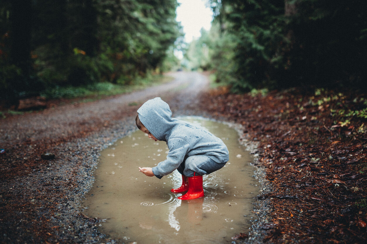 Child playing in puddle (Photo: iStock - RyanJLane)