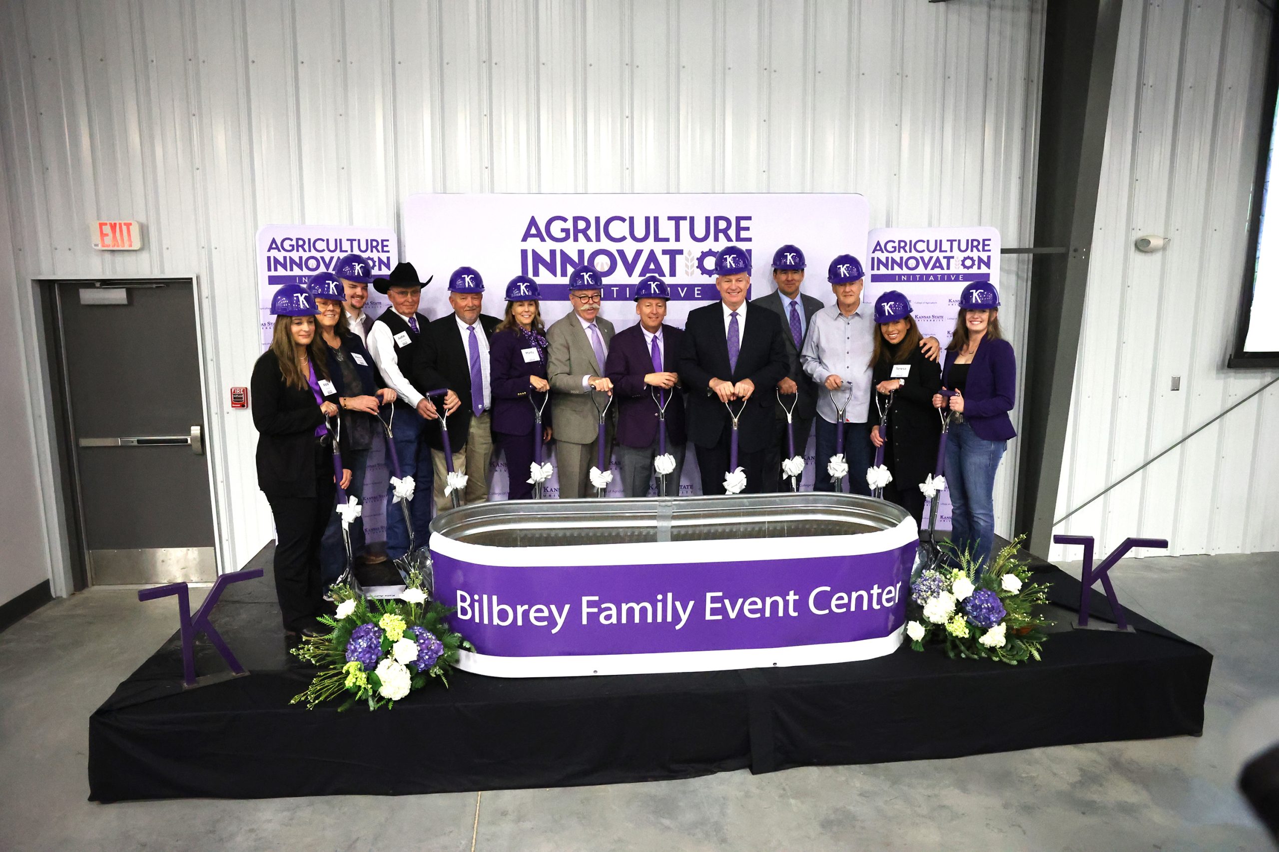 Dignitaries for the ceremonial groundbreaking include, pictured left to right are Kala Ade, representing GH2 Architects; Jeanne Mabery, representing the Marvin Robinson and Jack Goldstein charitable trusts; Kansas State University senior Brody Nemecek; Justin Janssen, K-State College of Veterinary Medicine; Mike Day, department head for K-State Animal Sciences and Industry; Marty Vanier, project donor; Ernie Minton, Eldon Gideon Dean of K-State's College of Agriculture; K-State President Richard Linton; Carl Ice, Kansas Board of Regents vice chair; Gregg Willems, K-State Foundation president and CEO; JP and Theresa Bilbrey, project donors; and K-State senior Kristen Kahler. (Photo by Bill Spiegel.)