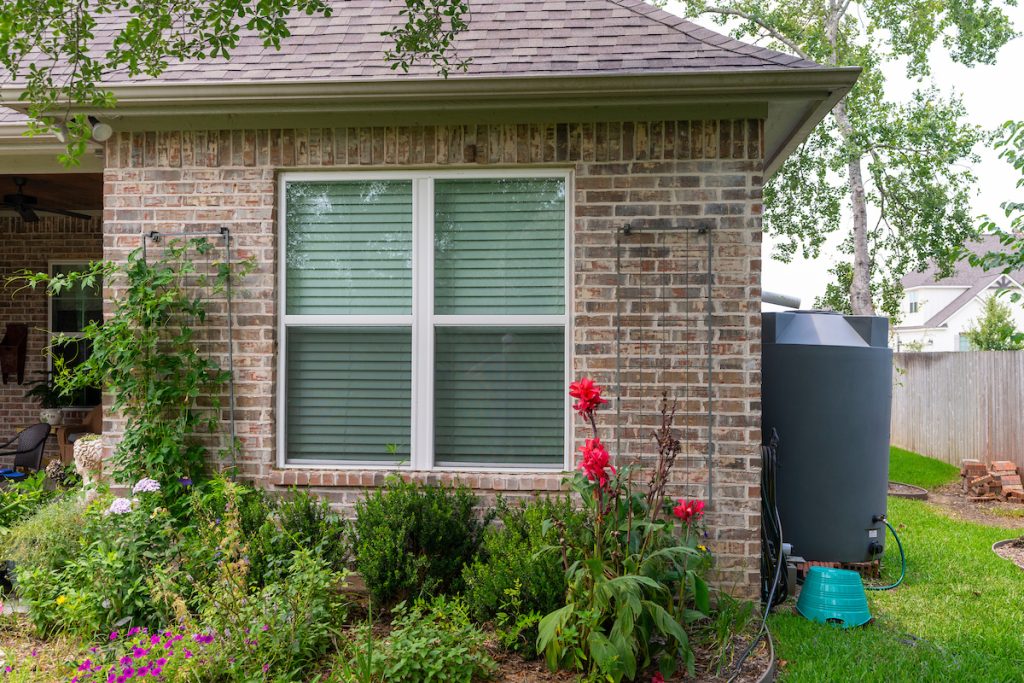 Garden resolutions for 2024 may include saving water. Utilizing a catchment system off a home’s rain gutter is a great way to help keep gardens growing during times of drought. (Texas A&M AgriLife photo by Michael Miller)