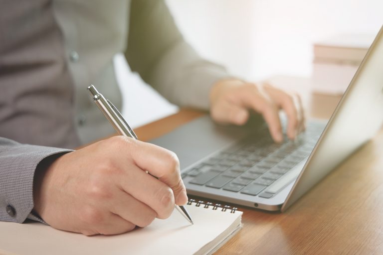Businessman using laptop for work in the office. (Photo: iStock - Pornyot Palilai)