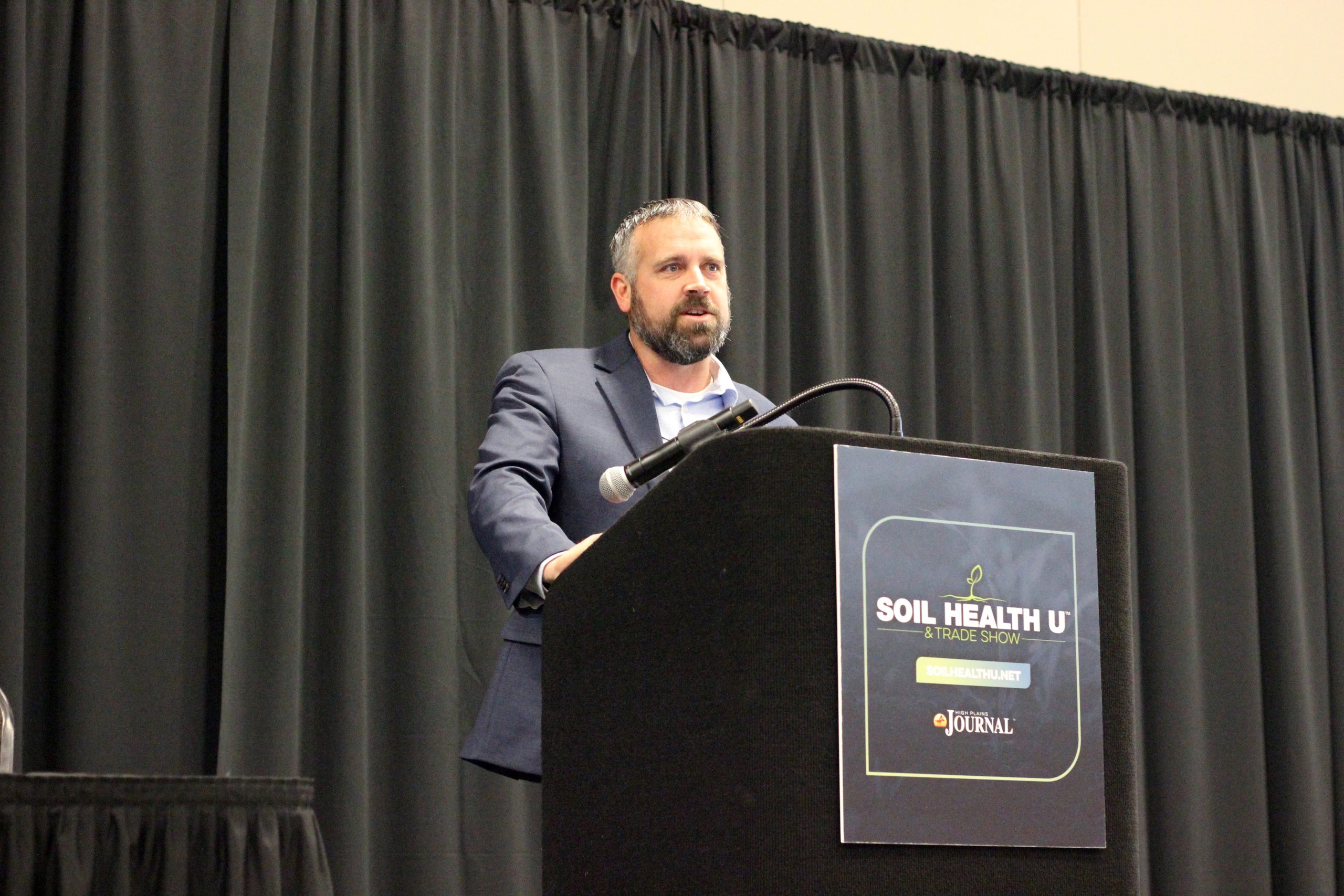Joshua Gaskamp, consultation manager at Noble Research Institute, spoke about grazing for soil health at the recent Soil Health U event in Salina, Kansas. (Journal photo by Lacey Vilhauer.)