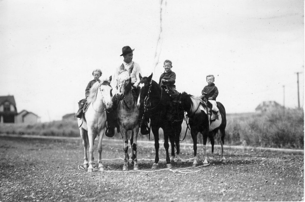 Will and his children riding horseback. (Photo courtesy Will Rogers Memorial Museum.)