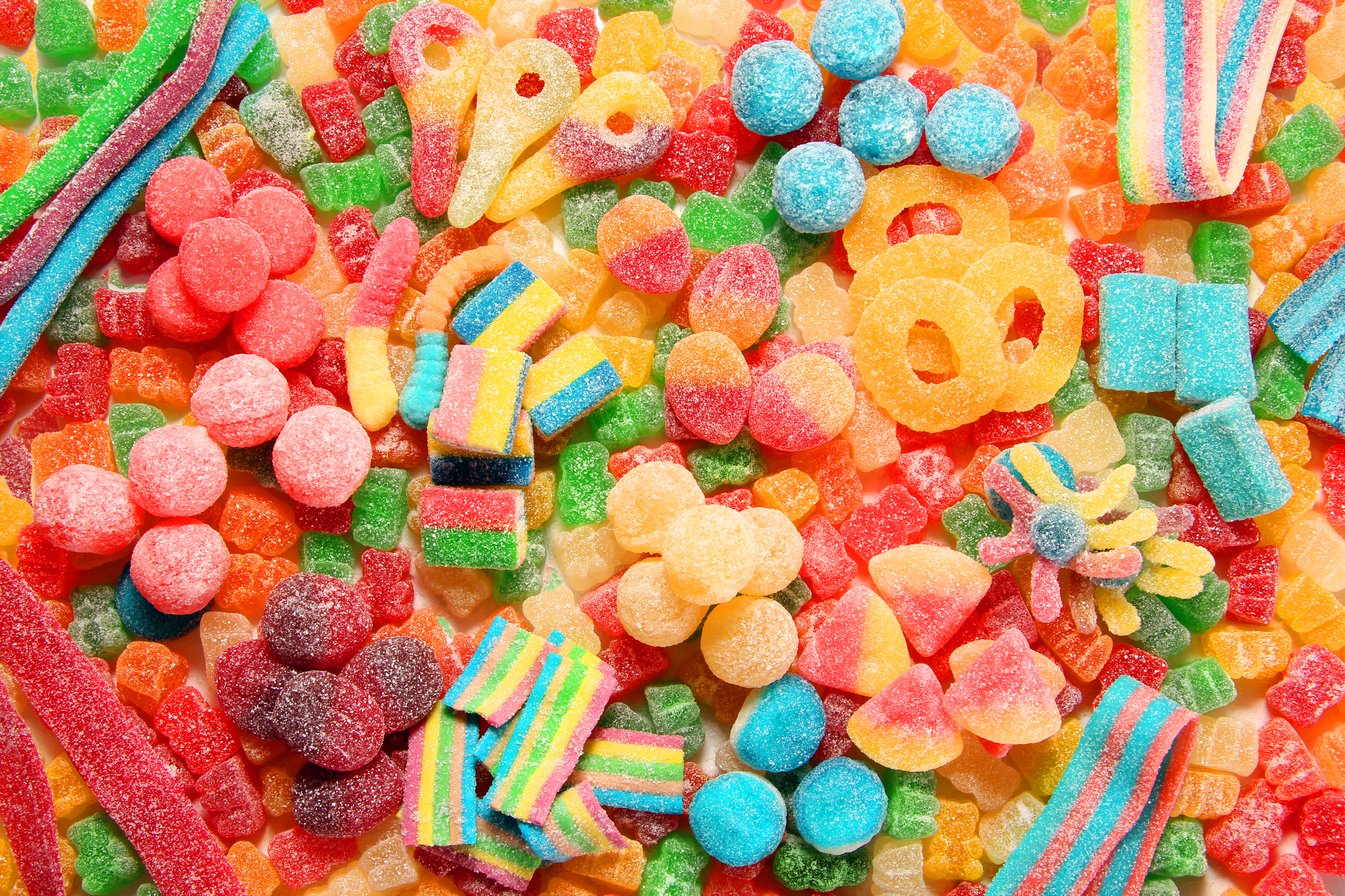 Assorted variety of sour candies includes extreme sour soft fruit chews, keys, tart candy belts and straws. (Photo: iStock - HannamariaH)
