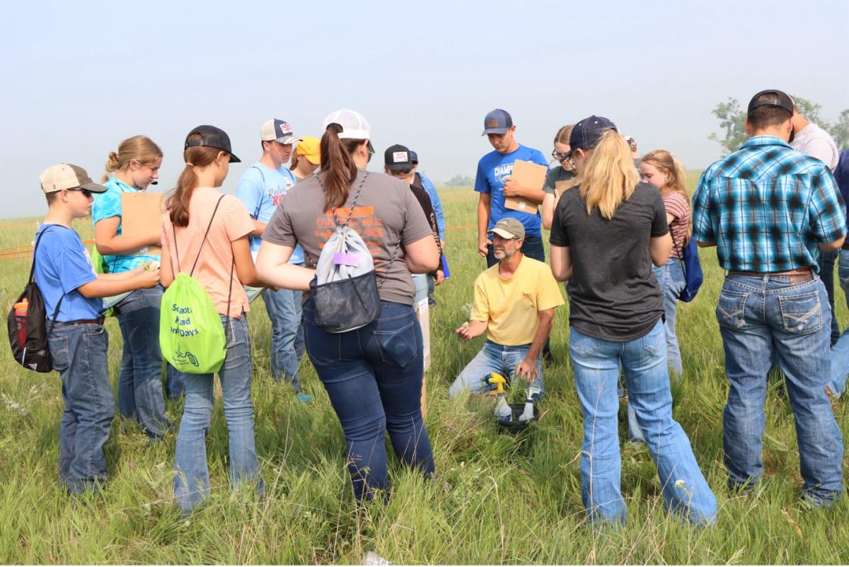A volunteer explains one of the stations during the 2023 Rangeland and Soils Days contest. The 2024 event is June 12-13, 2024, in Watertown. (SDSU Extension photo)