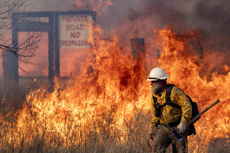 Firefighters battle flames from the reignited Smokehouse Creek fire outside of Miami. (Texas A&M AgriLife photo by Sam Craft)