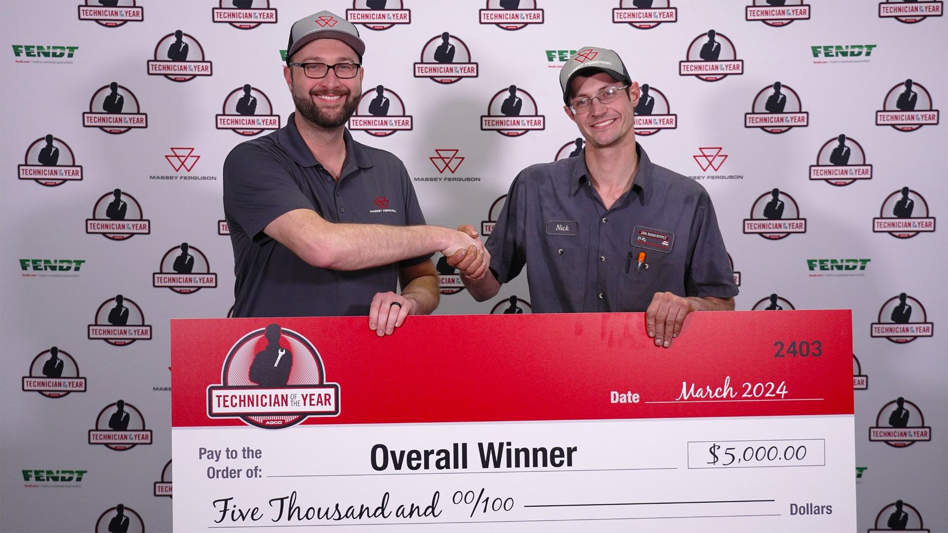 sh Alt, manager of technical training in North America presents a $5,000 grand prize to Nick Nelson. (Courtesy photo.)