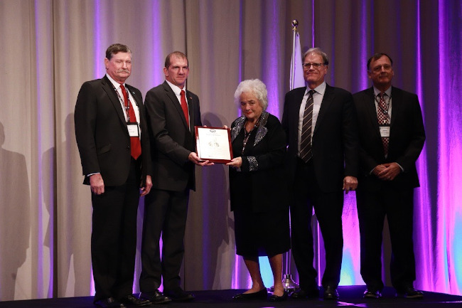 The late Bill Prestage was honored as the 2024 Pork Industry Hall of Fame recipient commemorated by (from left) Ron Prestage, National Pork Producers Council President Scott Hays, Martha Prestage, Scott Prestage and John Prestage. (Courtesy photo.)