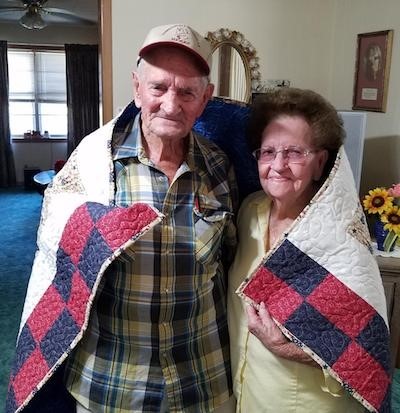 WWII veteran Allen Baker, shown here with wife Bobbie, was among those awarded a quilt through the Texas 4-H and Under Our Wings/Quilts of Valor partnership. (Larry Hume/VFW Post 8904 Quartermaster)