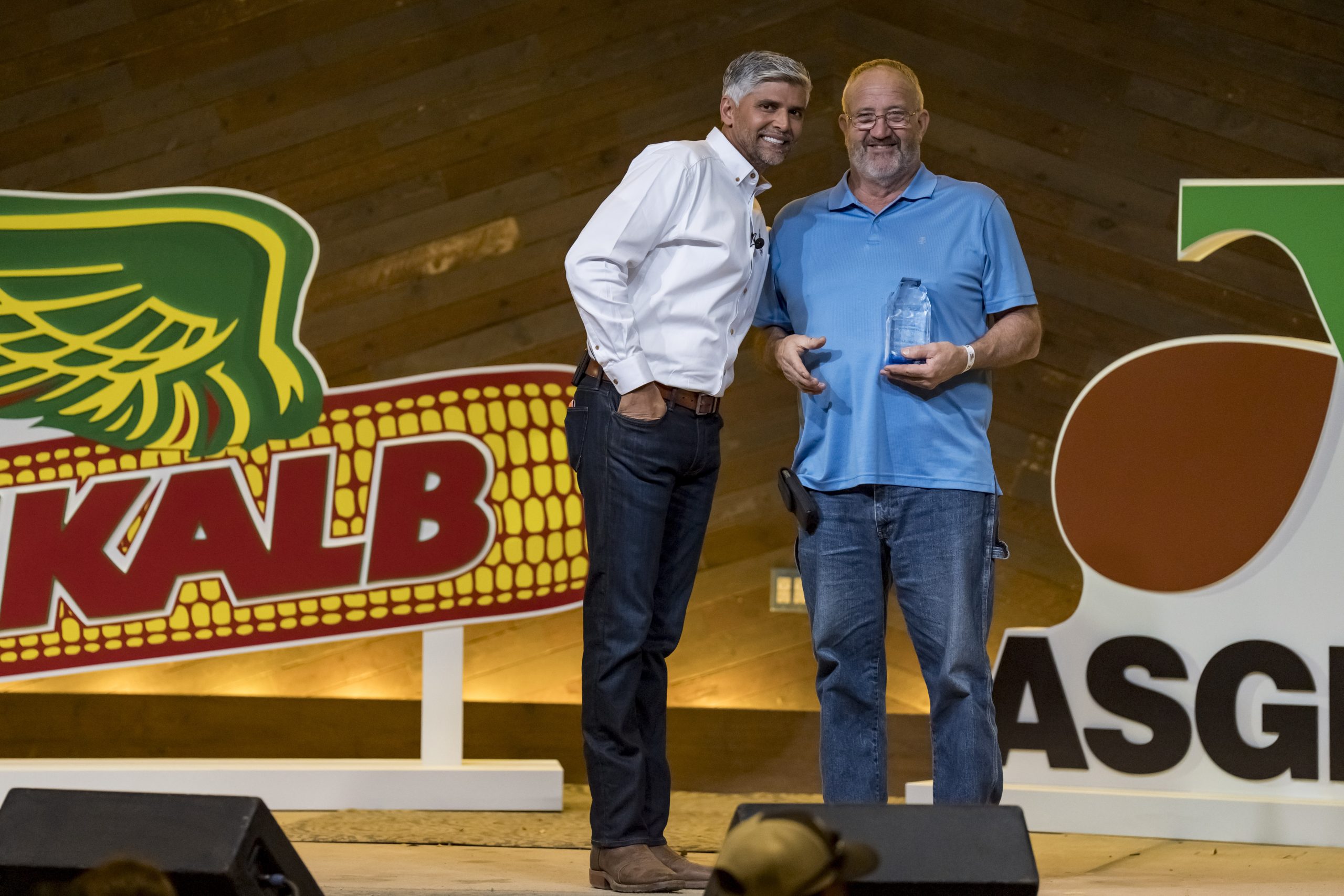 Dickinson County, Kansas, soybean grower Gregg Sexton (at right) was recognized by Asgrow during the Commodity Classic with his 96.3 bushel per acre production. His award was presented by DEKALB Asgrow Brand Lead Dipal Chaudhari. (Courtesy photo.)