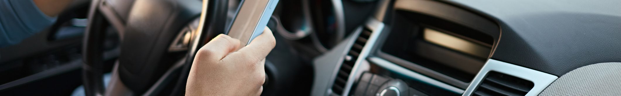 Driver using mobile phone while driving. (Photo: iStock - perfectlab)