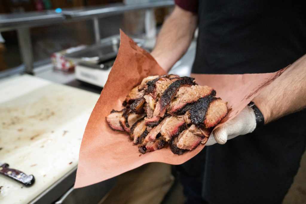 Texas barbecue has become an iconic culinary and cultural dish. The Brisketeers and pitmasters around the state continue to push the boundaries of the low and slow science behind barbecue. (Courtney Sacco, Michael Miller/Texas A&M AgriLife)