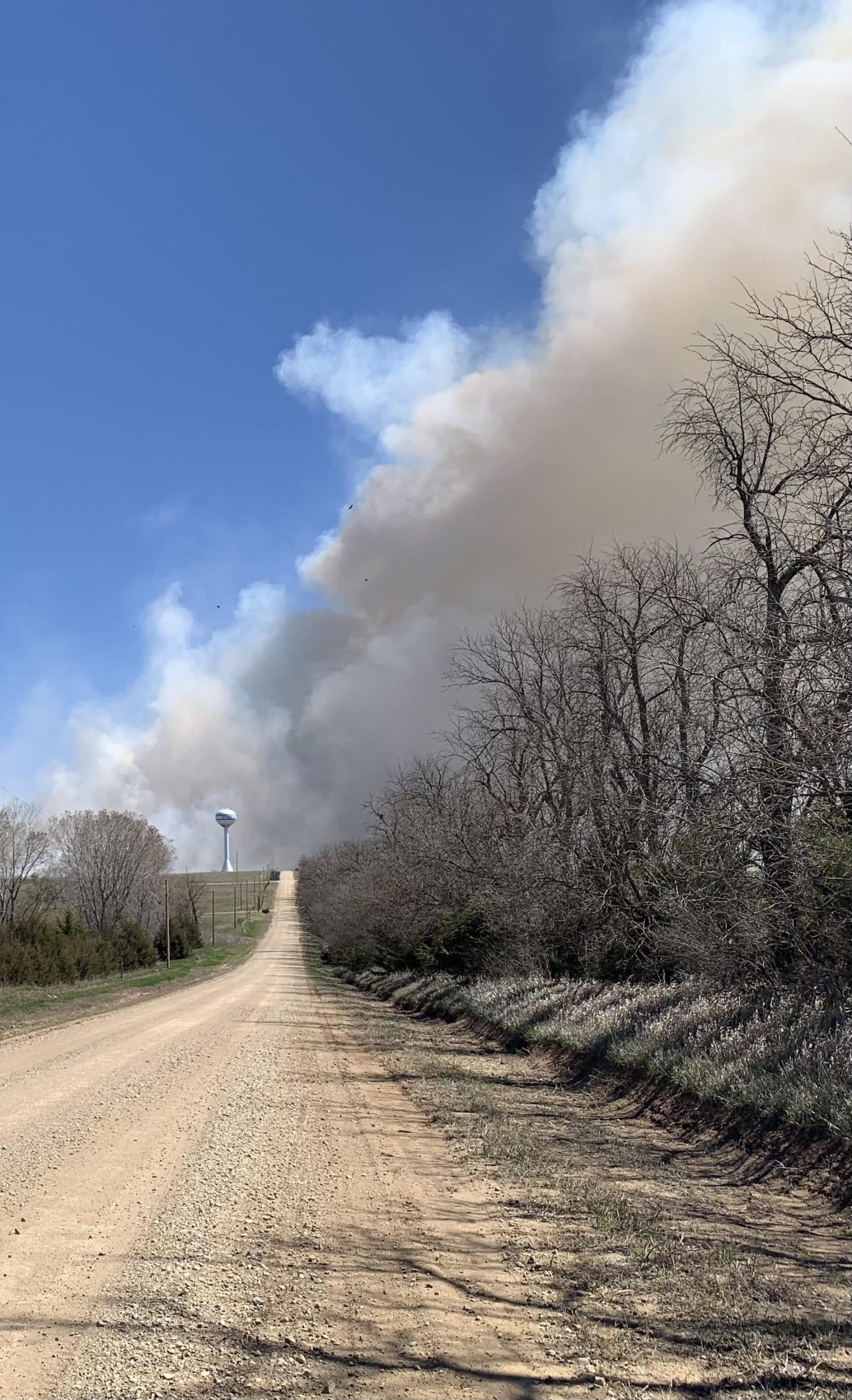 Visibility may be reduced from smoke and flames when grass and crop stubble are being burned, such as in this April 4 fire in southeastern Ottawa County. (Photo by Tim Unruh.)