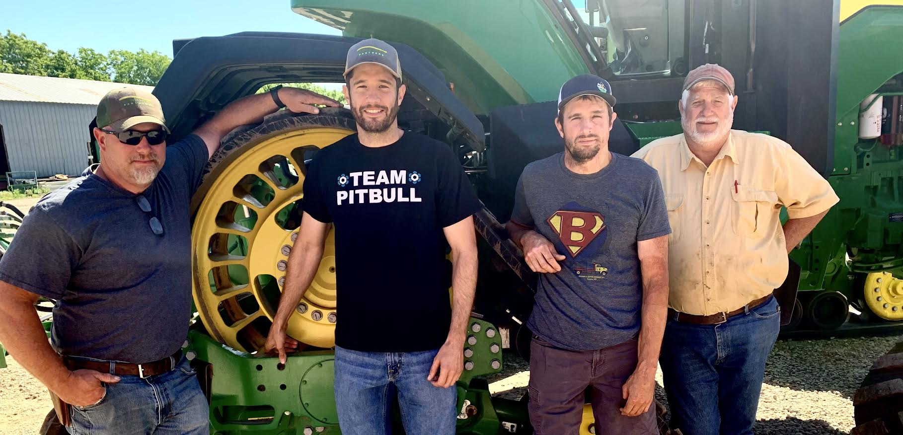 Members of the Short farming crew pose at the farmstead in southern Saline County, Kansas. Left to right are Tyler Ash, Matt Short, Zach Short and Chris Short. (Photo by Tim Unruh.)