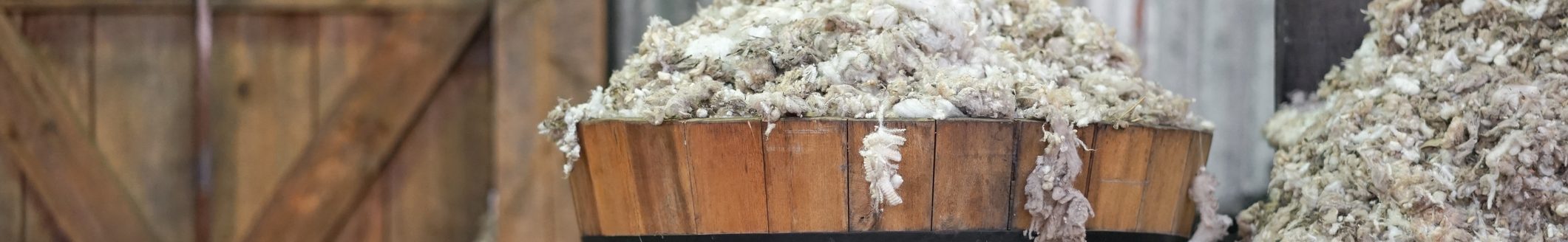 A wooden bucket full of wool after sheep shearing. (Photo: iStock - EnchantedFairy)