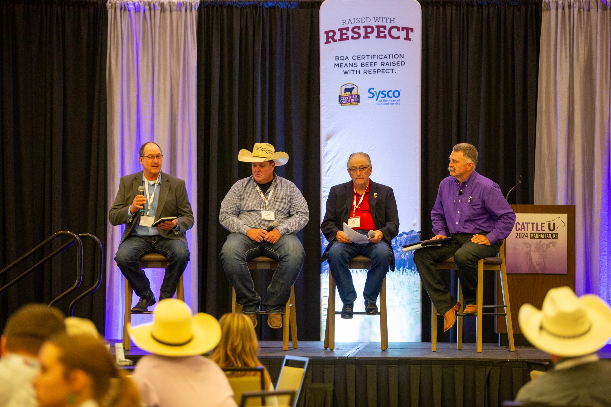 Included on the producer panel at Cattle U June 25 in Manhattan, Kansas was from left, Mark Diederich, Tyler Burkey and Bill Rishel. Mark Gardiner, far right, moderated the panel. (Journal photo by Kylene Scott.)