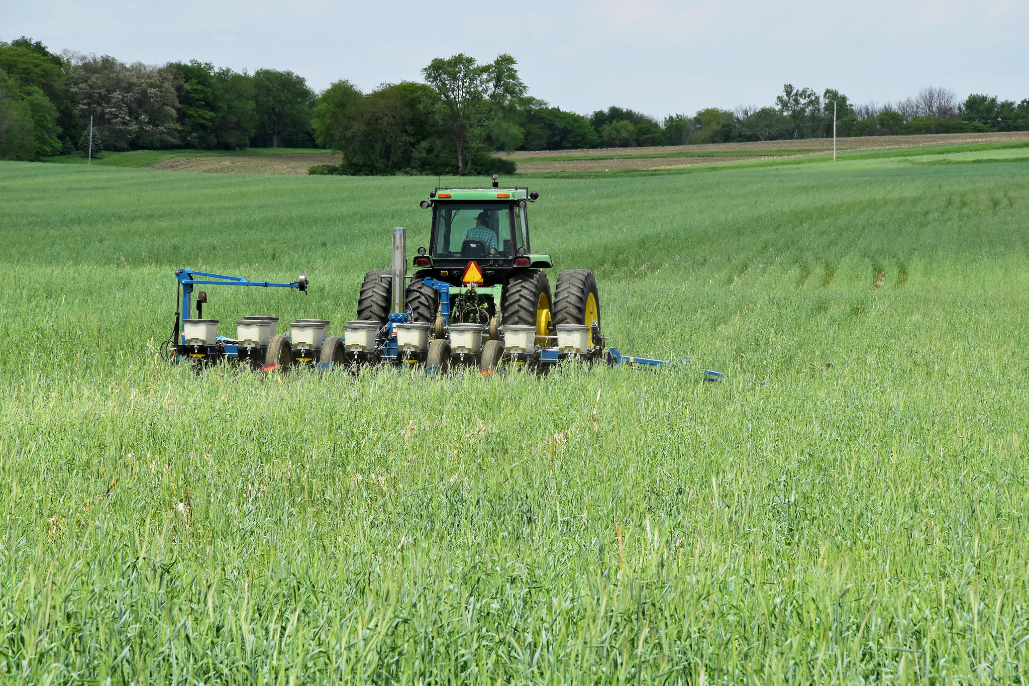 A farmer plants soybeans into a cover crop stand of cereal. (Photo courtesy of Jason Johnson/Iowa NRCS)