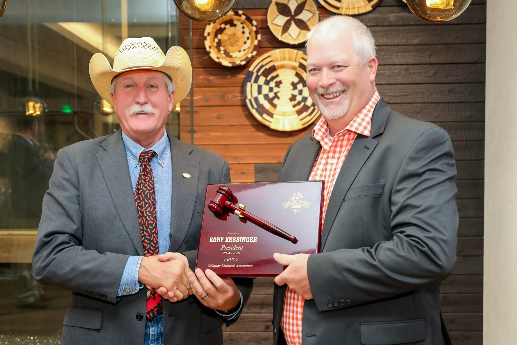 Kenny Rogers, Colorado Livestock Association president congratulates newly elected president Kory Kessinger at the CLA annual meeting July 15 to 16 in Black Hawk, Colorado. (Courtesy photo.)