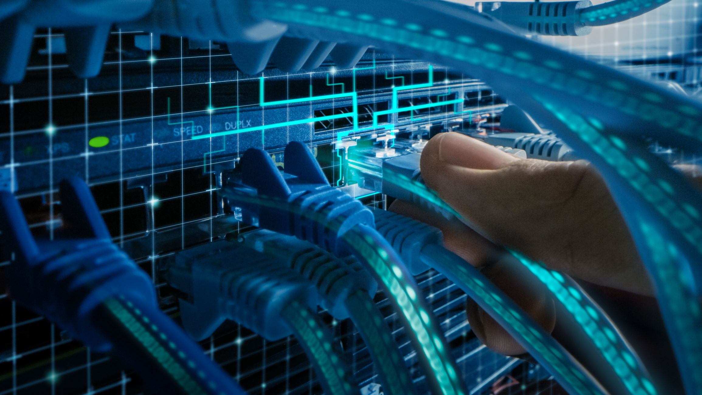 Macro Shot with Augmented Reality: IT Administrator Plugs in RJ45 Internet Connector into LAN Router Switch. Cables with Virtual Graphichs Showing Data Transfer. (Photo: iStock - gorodenkoff)