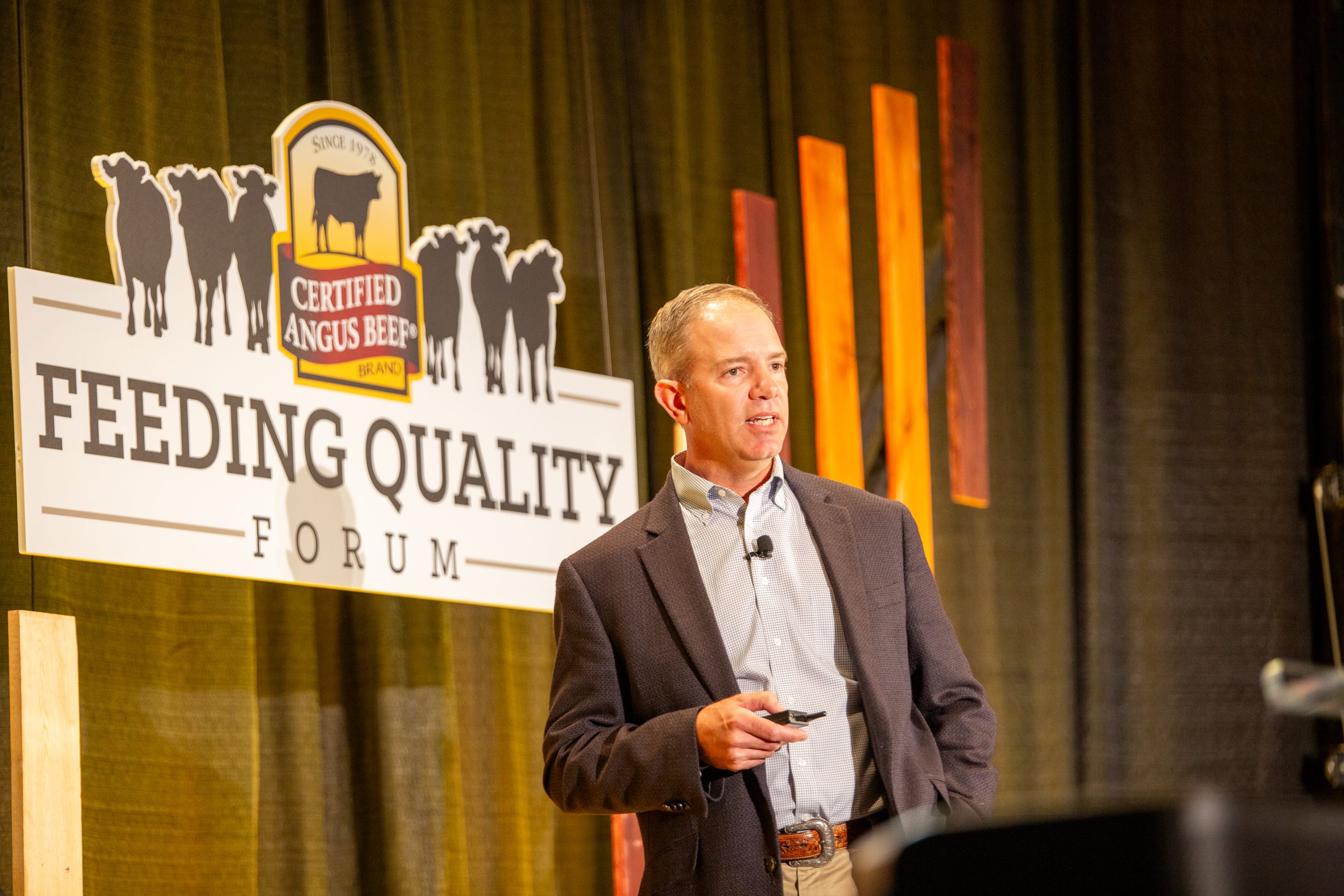 Paul Dykstra with Certified Angus Beef discussed how influential the 10 percent of Angus-influenced cattle who miss the upper two-thirds of Choice by only 30 points are at the Feeding Quality Forum in Dodge City, Kansas, Aug. 20. (Journal photo by Kylene Scott.)