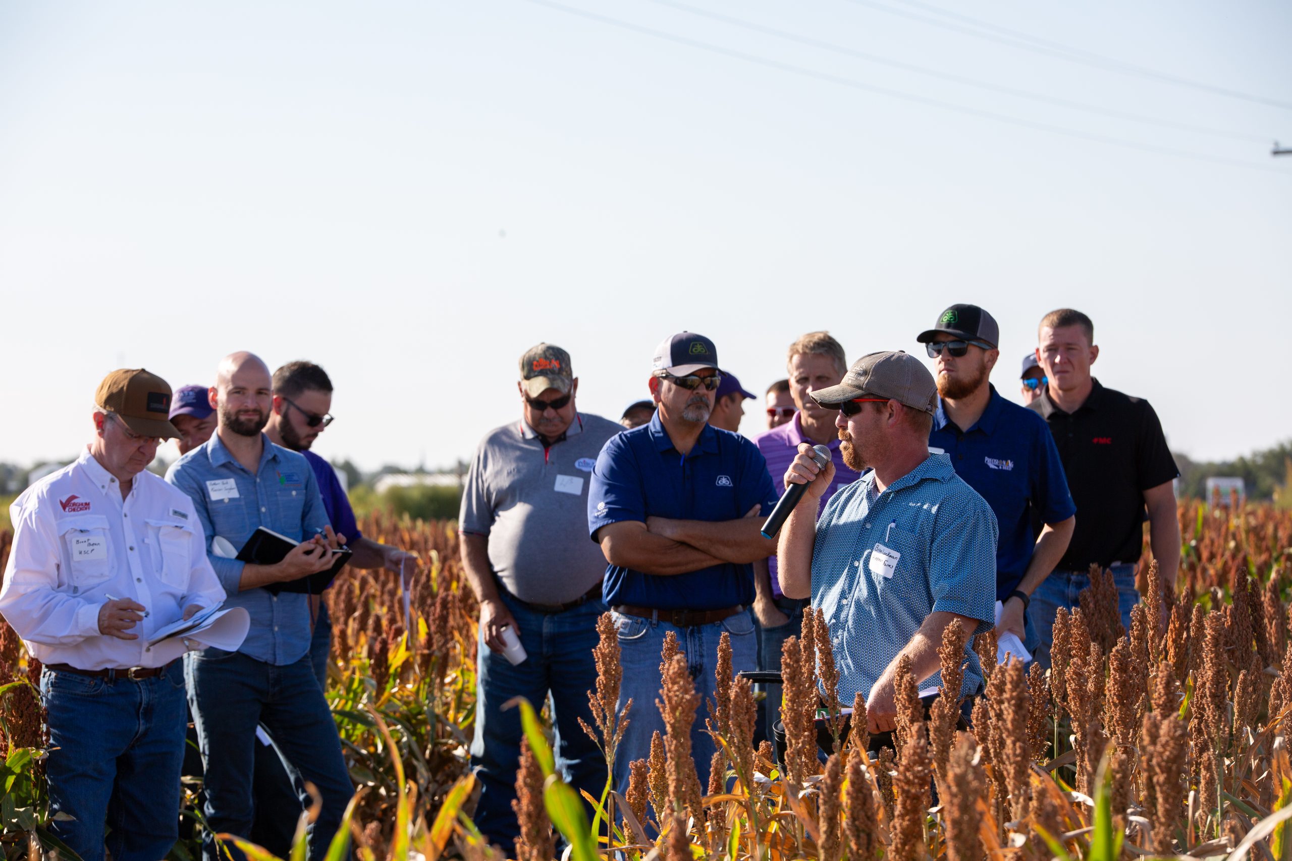 Brian Lockman agronomist with Hineman Farms, Dighton, Kansas discussed the plot variety trial details with attendees at the Sorghum Connection field day Sept. 11. The event was hosted by Kansas Grain Sorghum Commission and Kansas State University. (Journal photo by Kylene Scott.)