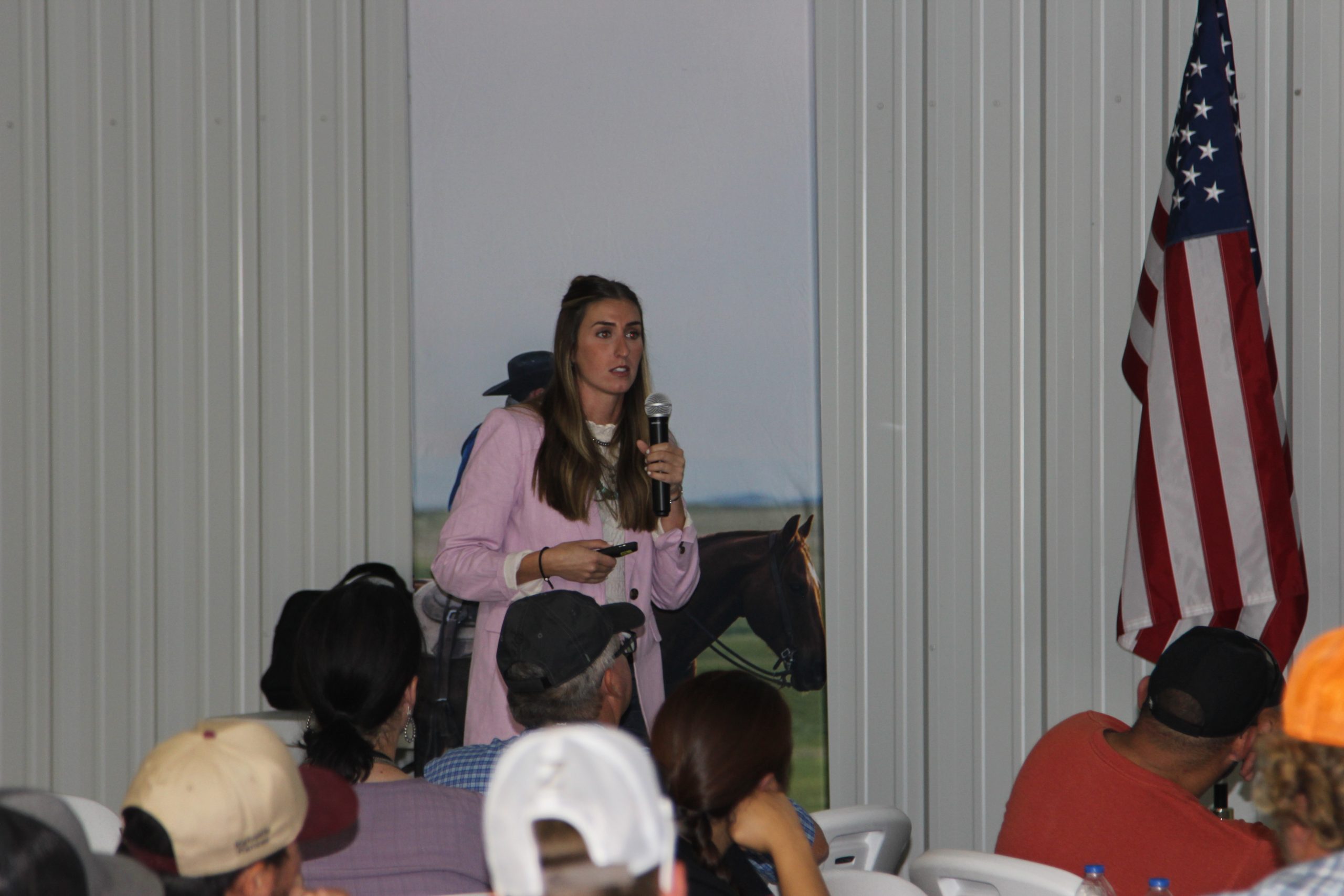 Kirsten Nickles addresses Beef Quality Assurance program participants at the Hy-Plains Feedyard LLC research center. (Journal photo by Dave Bergmeier.)