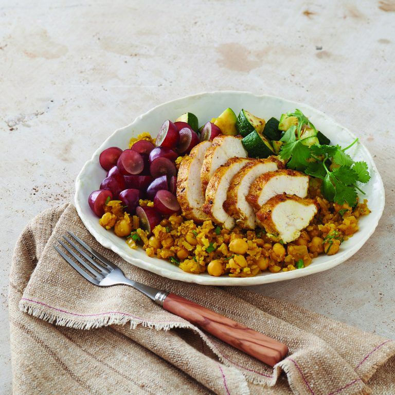 Chicken and grape cauliflower rice bowl. (Photo courtesy of Family Features/California Table Grape Commission.)