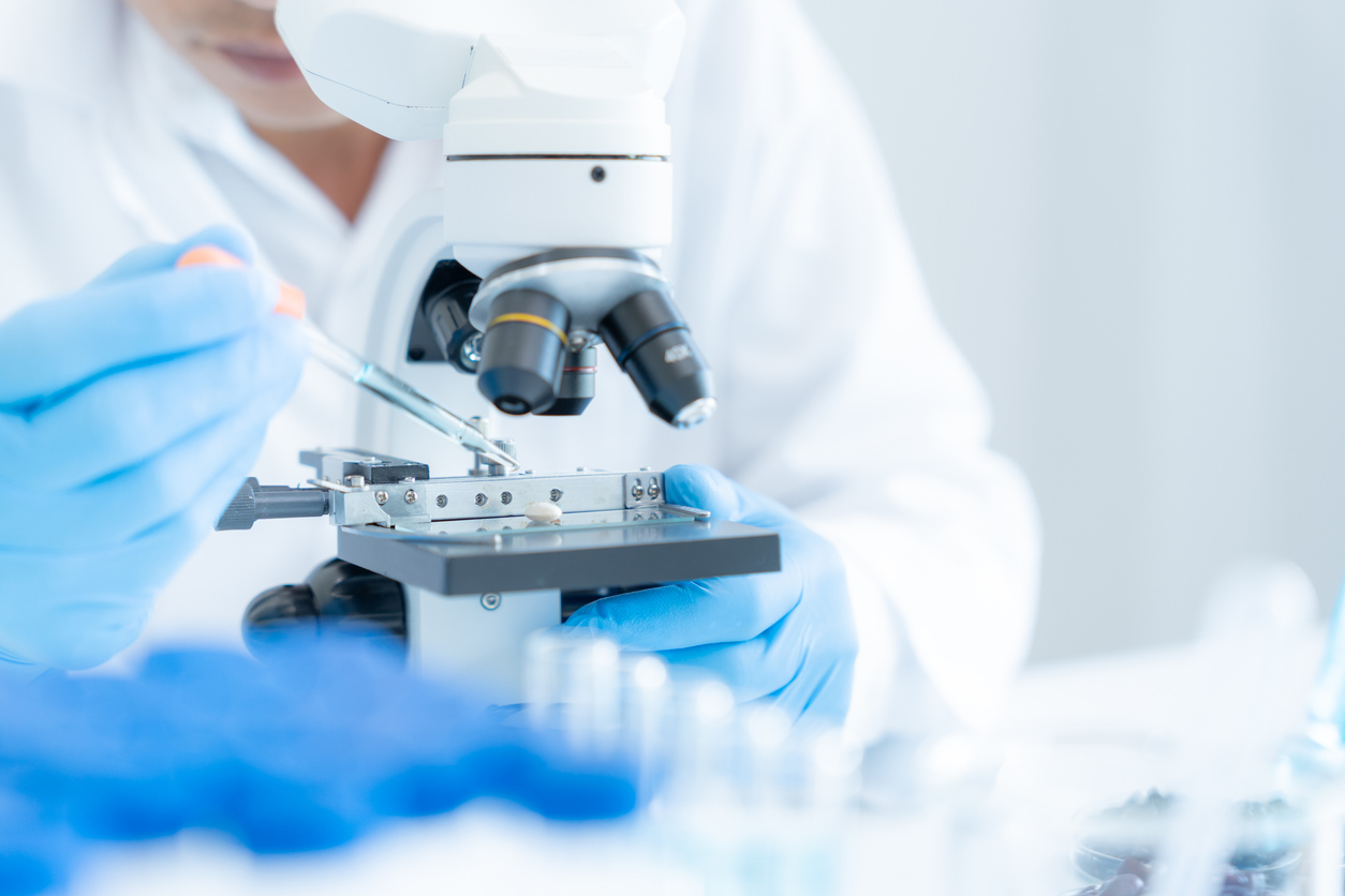 Scientist analyze biochemical samples in advanced scientific laboratory. Medical professional use microscope look microbiological developmental of viral. Biotechnology research in science lab. (Photo: iStock - Nuttawan Jayawan)